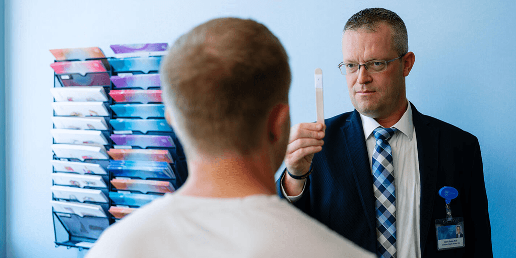 Doctor working with patient's eyes.