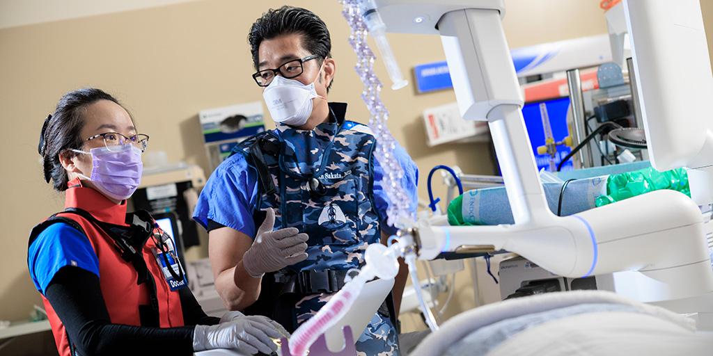 Two fellows in operating room.