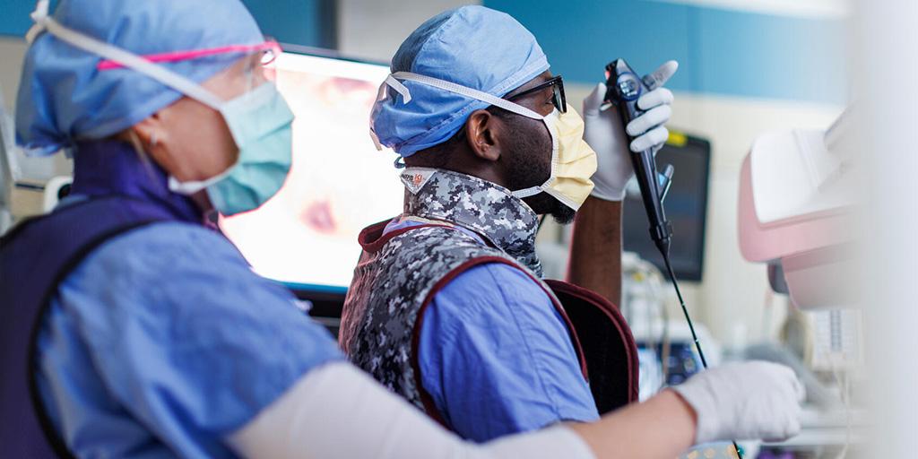 Two people performed a procedure.