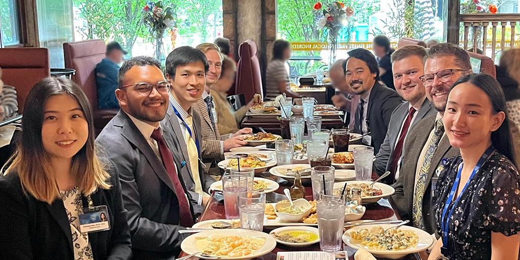 A group of residents enjoy a meal together inside a restaurant.