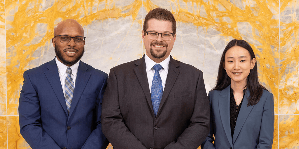Shaquan David, PhD, Zach Stottler, PhD, and Xueyan Tang, PhD, Radiation Oncology Clinical Medical Physics senior residents, pose for a photograph together.