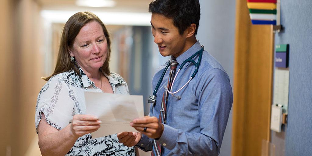 Mayo Clinic trainee reviewing patient record with colleague