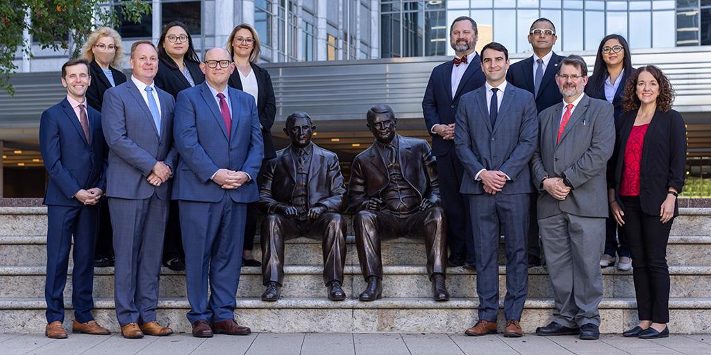 Transfusion Medicine consultants, staff, and fellows gather for a group photograph with the Mayo Brothers statue.