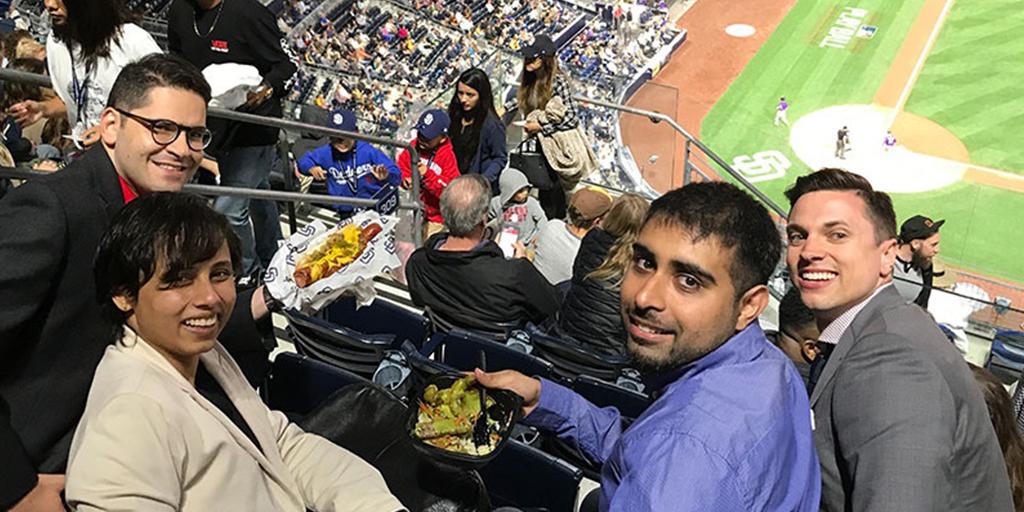 Vascular surgery fellows spending time together at a baseball game.
