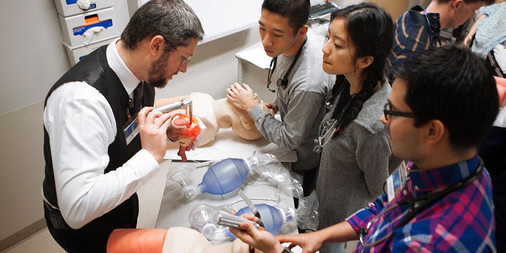 Mayo Clinic M.D. Program students learning airway technique from faculty member