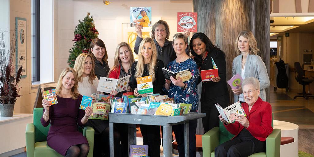 Members of the Alice Mayo Society Board with the members of the Mayo, Alice Mayo Society, Children's Center, Books Drive, Clinic Child Life specialists, for the Book Drive Collaboration.