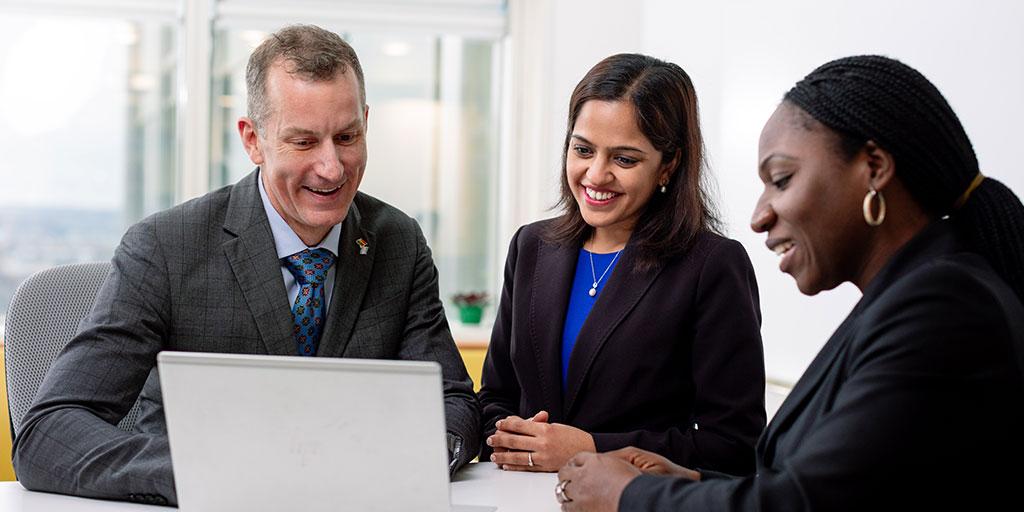 Mayo Clinic staff talking around a table