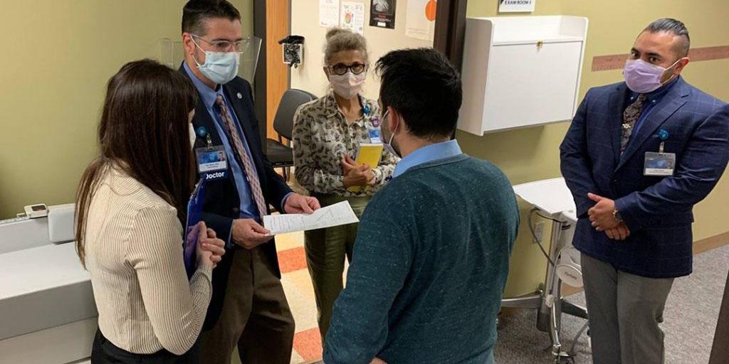 A team of Mayo Clinic medical students and faculty speaking together at the ENT Community Clinic in Rochester