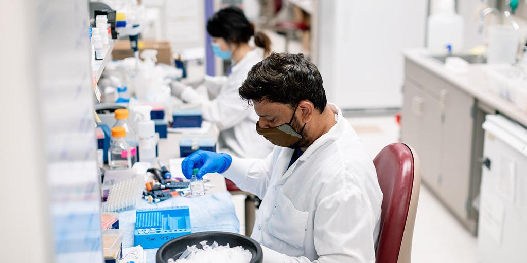 Medical lab professionals set up an experiment in a lab at Mayo Clinic
