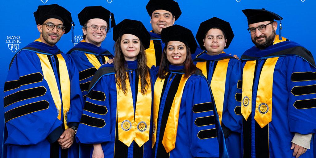 A group of graduates from Mayo Clinic pose for a picture at the 2023 commencement ceremony in Rochester