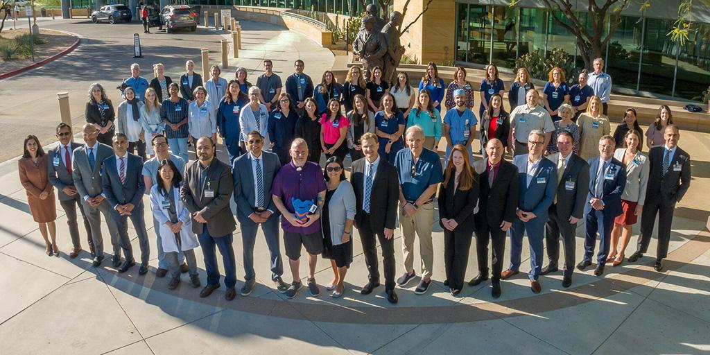 Group picture of all involved in the larynx transplant at Mayo Clinic along with the patient and his wife