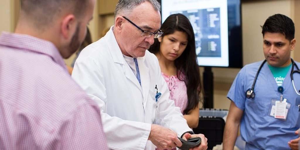 Students in a program sponsored by the Office for Diversity working with a Mayo Clinic faculty member
