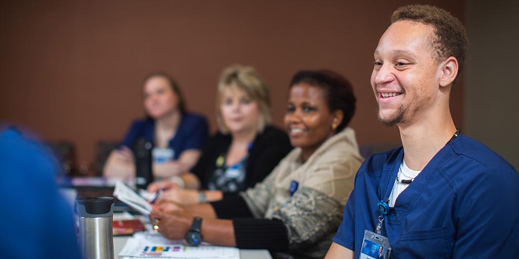Mayo Clinic student in classroom with other students and faculty