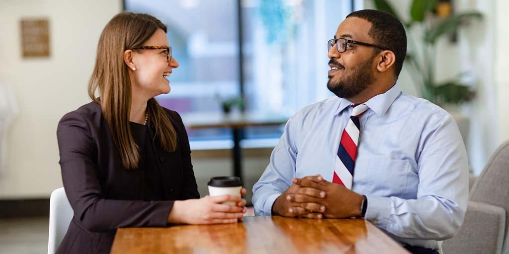 Two individuals in a meeting