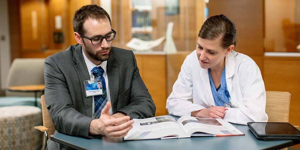 Two trainees studying together in a tutoring session
