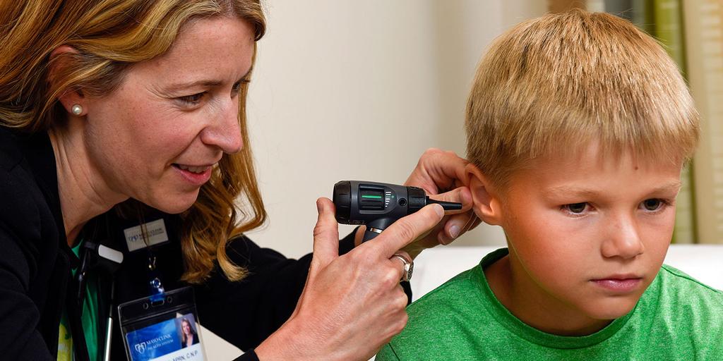 Mayo Clinic nurse practitioner examining a young patient