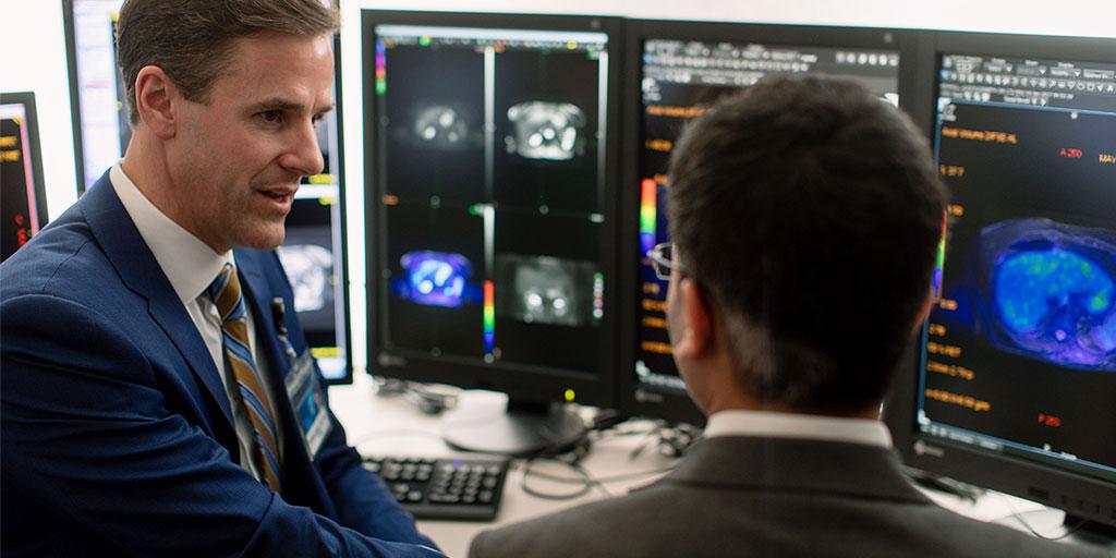 Mayo Clinic positron emission tomography (PET) technologists discussing results