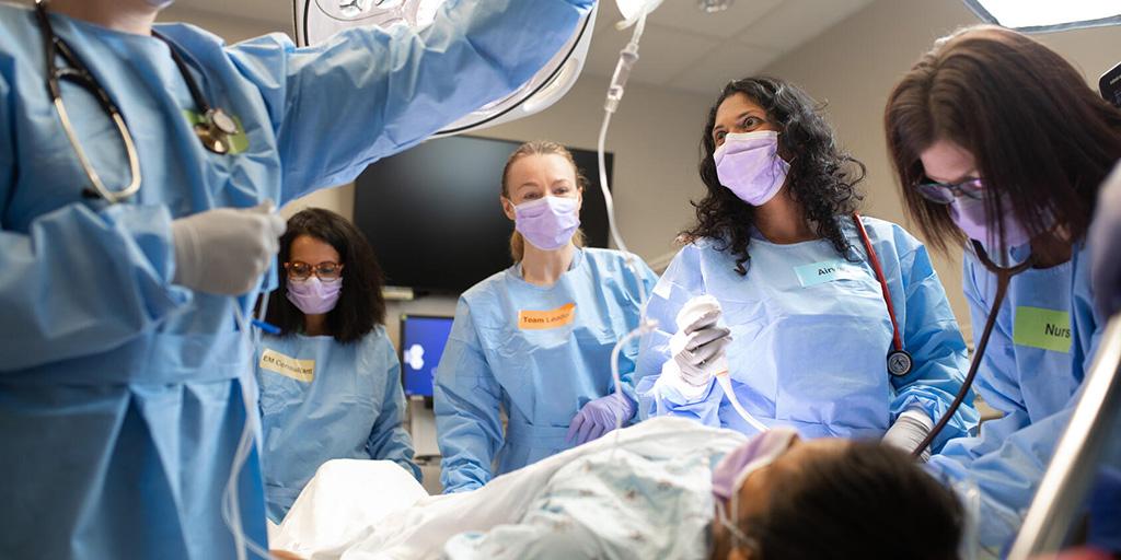 Physician assistant assisting on a surgery in the operating room