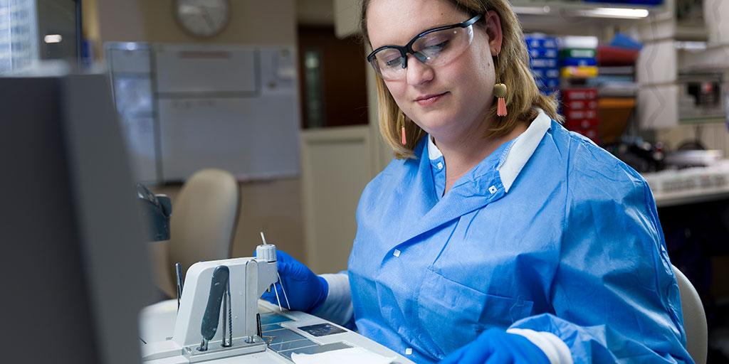 Histology Technician Program student learning how to process microscope slides
