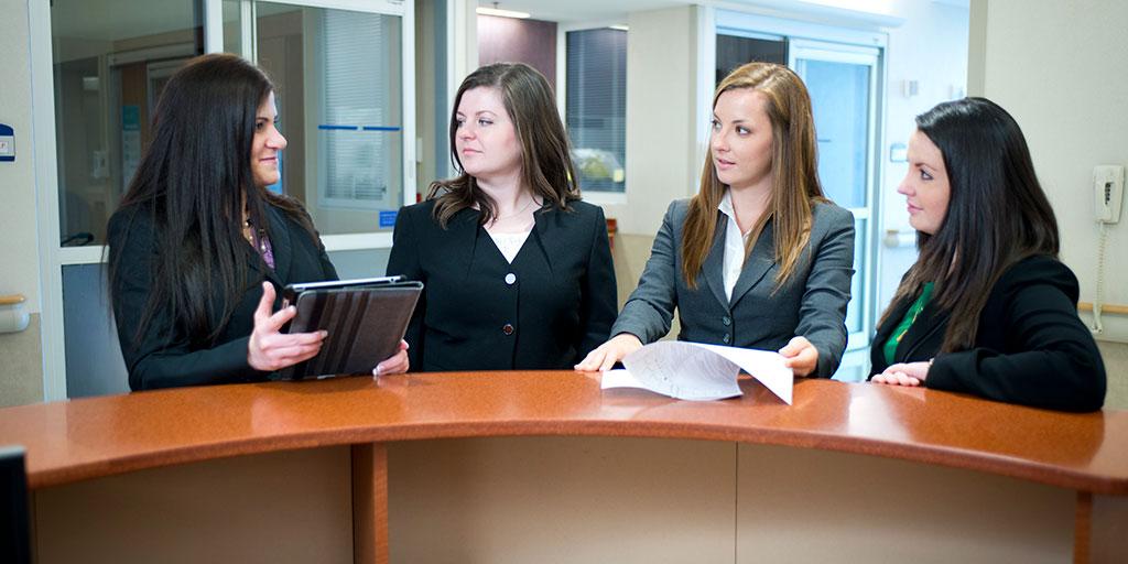Pharmacy residents collaborating in the hallway