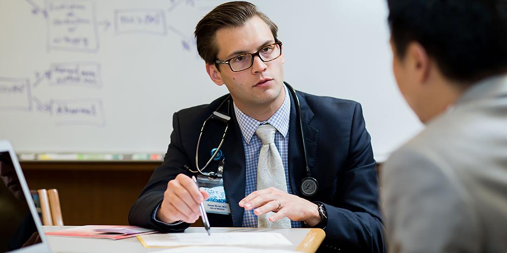 Pharmacy Resident speaks with faculty member at Mayo Clinic Health System in Eau Claire. 