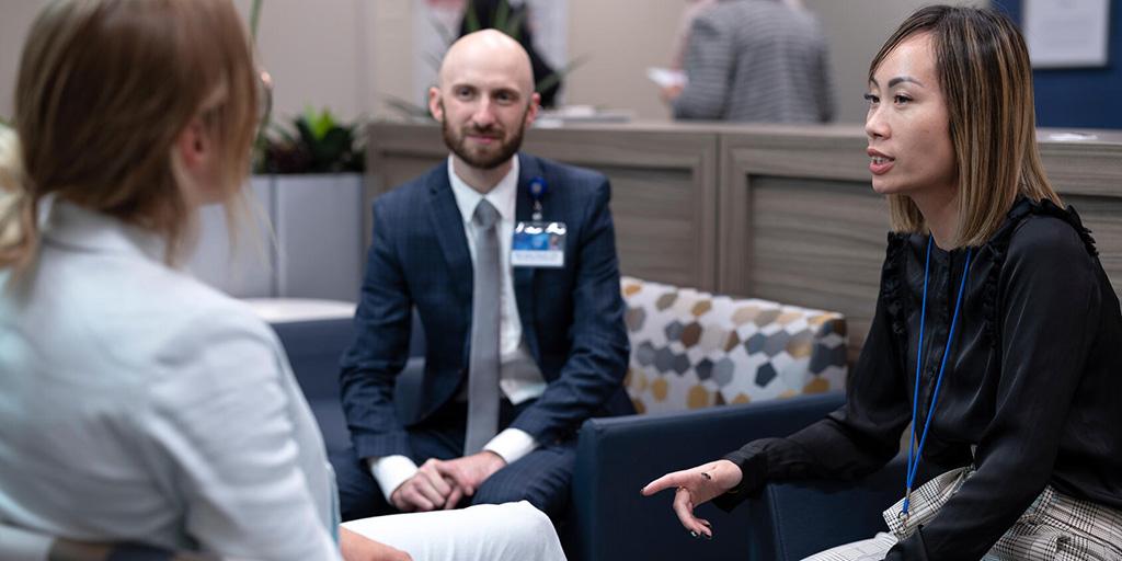 Pharmacy residents at Mayo Clinic in Arizona sit down and talk in the clinic