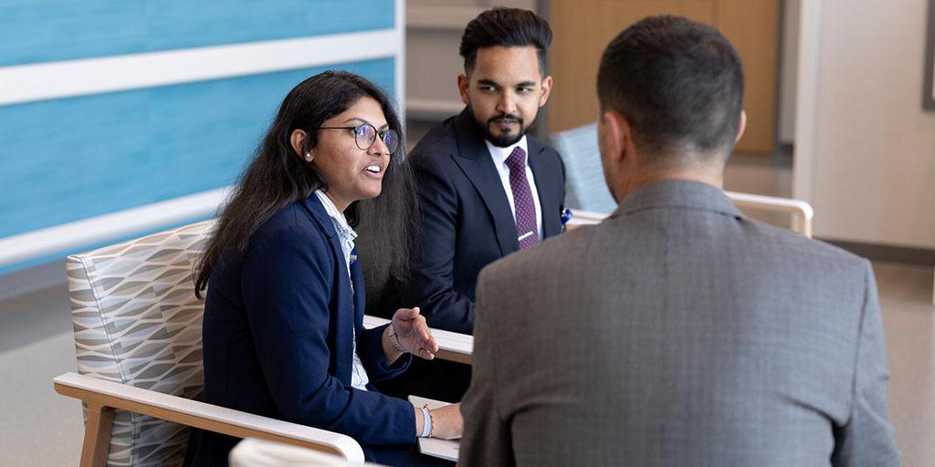 Pharmacy residents in Arizona sit in the lobby of Mayo Clinic to discuss classwork