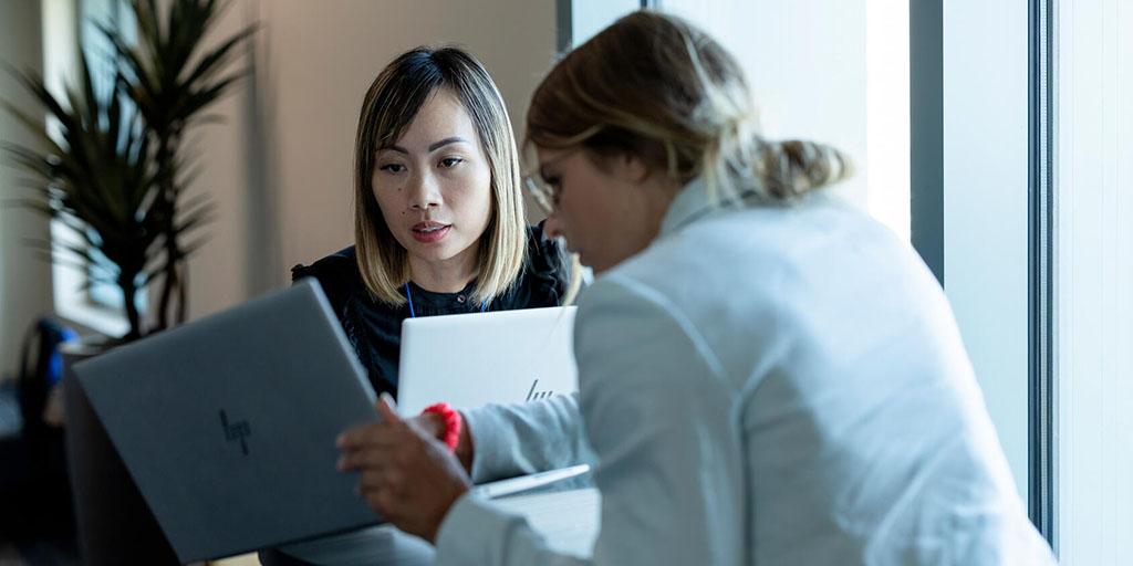 Two residents in the Solid Organ Transplant Residency at Mayo Clinic in Arizona look at a patient's paperwork together.