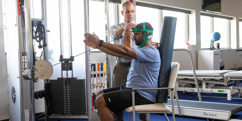 Physical Therapy resident performing therapy on a patient in a Mayo Clinic rehabilitation program in Florida.