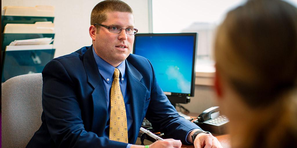 A Mayo Clinic social worker meeting with a patient