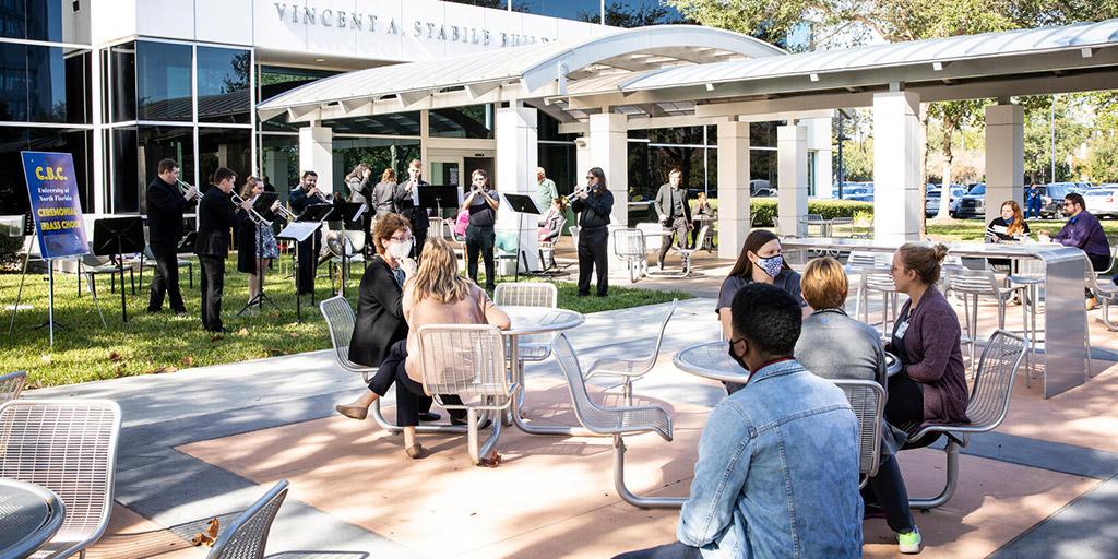 Group of students watching a musical performance outside at Mayo Clinic in Jacksonville, Florida.