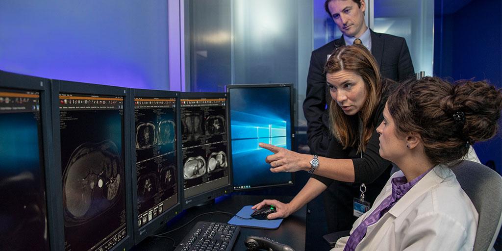 Trainees and staff discuss body radiology images at Mayo Clinic