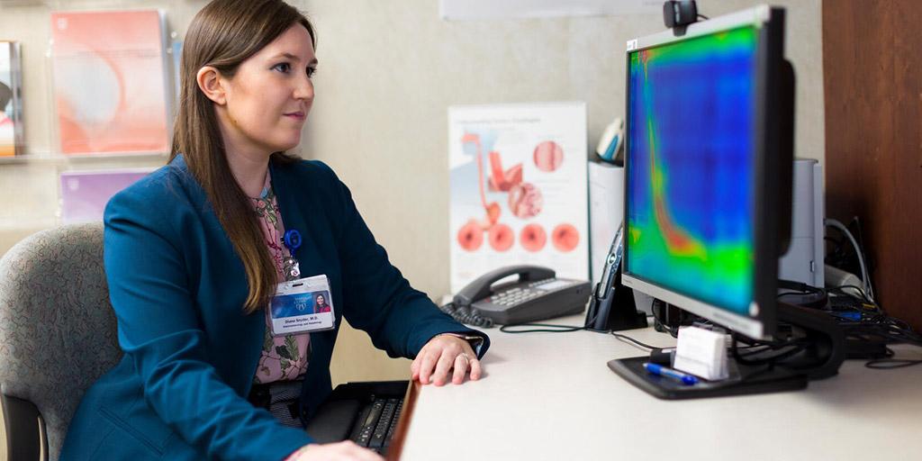 Advanced esophageal trainee working near a computer in a clinical room at Mayo Clinic in Phoenix, Arizona.