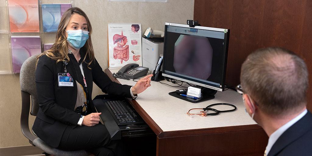 Advanced Esophageal Diseases Fellowship program director Jennifer Horsley-Silva, M.D., talks with a patient.