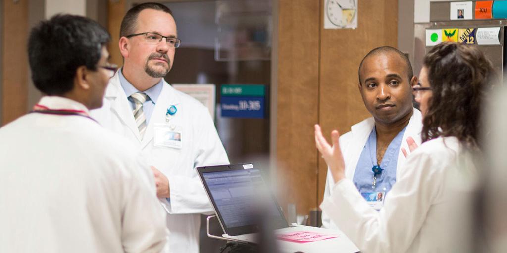ICU team discussing plans during rounds