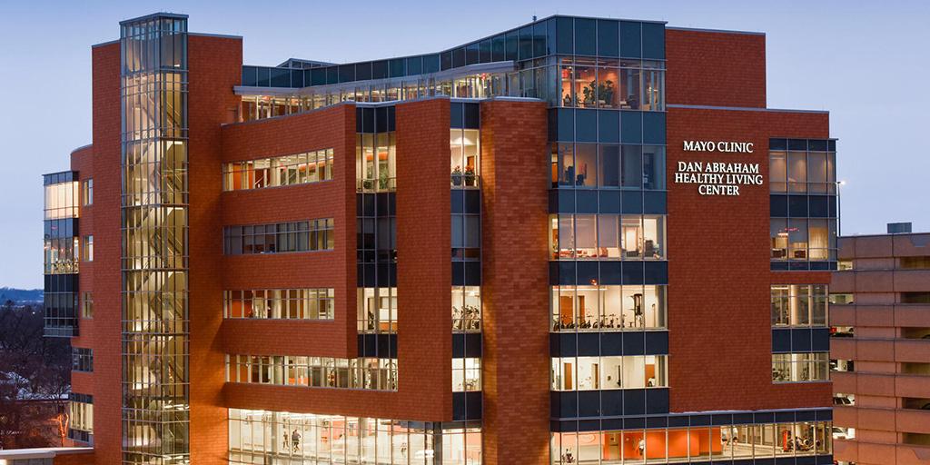 Dan Abraham Healthy Living Center lit up at night while people exercise.