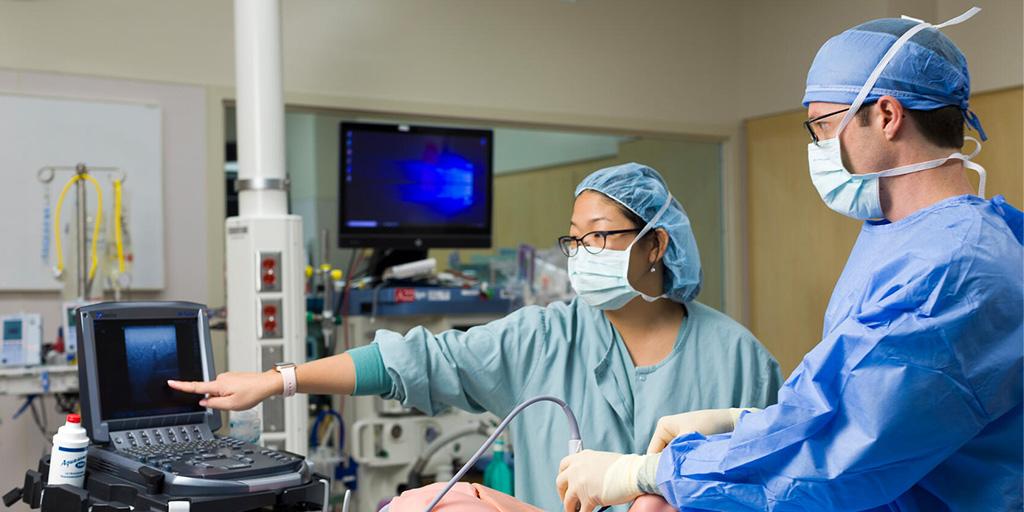 An anesthesiology resident conducting an ultrasound