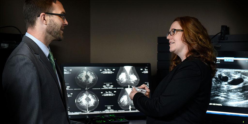 Two doctors reviewing radiologic images