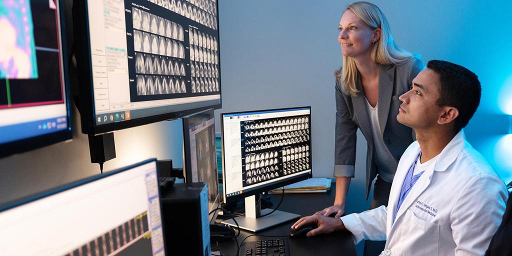 Two people from the Cardiology, Echocardiography Fellowship (Florida) at Mayo Clinic in Jacksonville, Florida, were in the reading room to view echocardiograms on several screens.