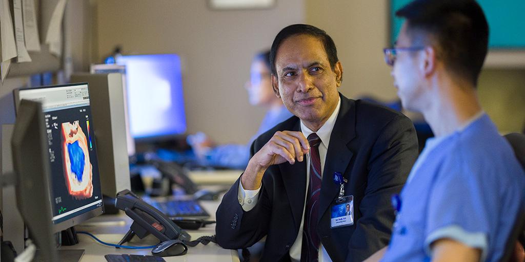 Two people from Cardiology, Echocardiology Fellowship in Arizona looking at screen