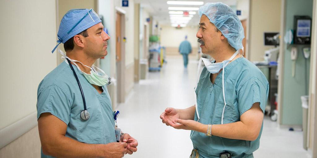 Heart Failure and Transplant Cardiology fellow and faculty member talking in the hall at Mayo Clinic in Jacksonville, Florida.