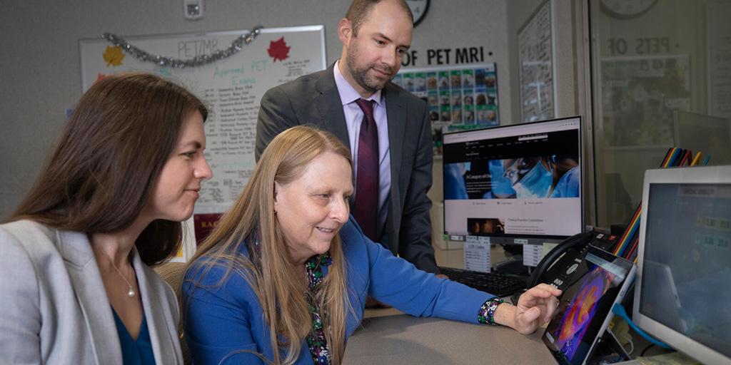 Cardiothoracic Imaging Fellowship in Jacksonville, Florida, three doctors review scans.