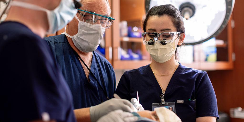 Mayo Clinic dermatology residents in Minnesota examining a patient