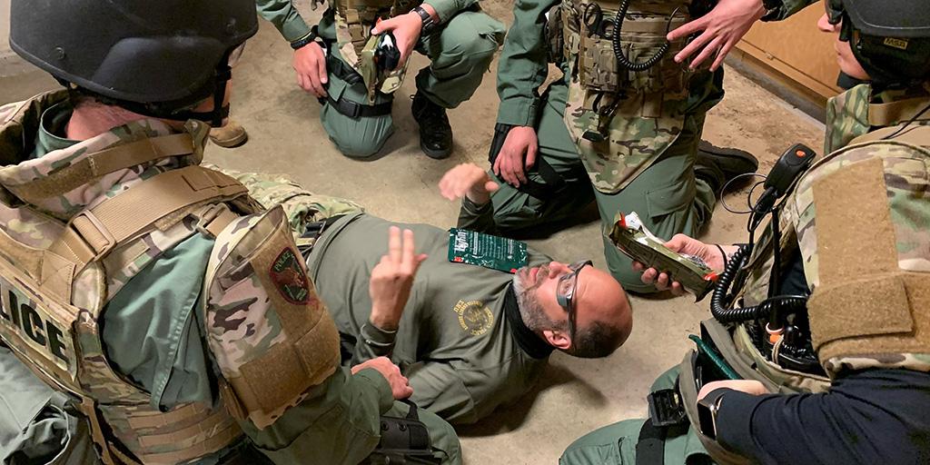 Individuals in special operations training for an emergency situation