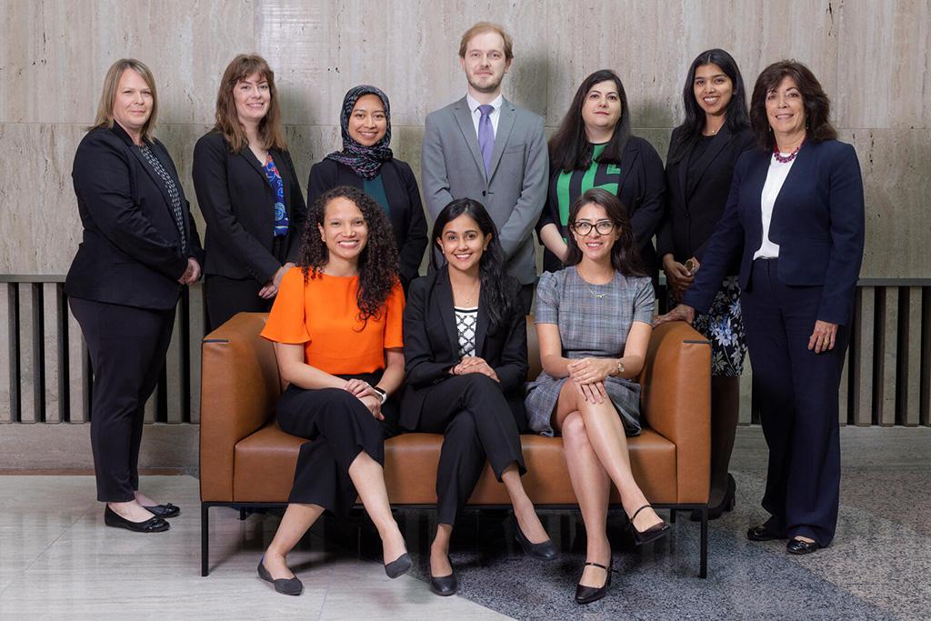 A group of ten faculty, staff, and trainees gathered for a portrait.