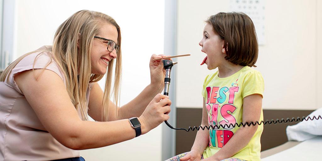 A Mayo Clinic Family Medicine resident checking a patient