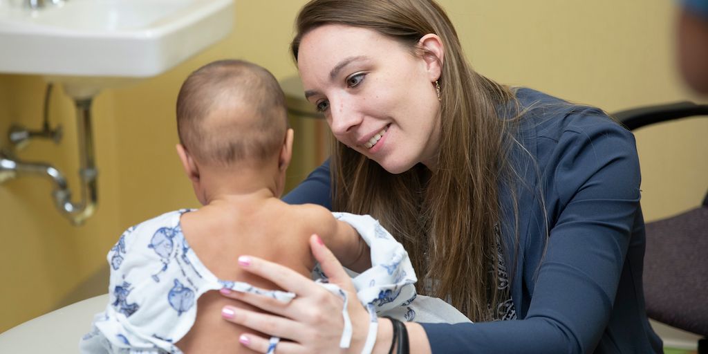 A Mayo Clinic family medicine resident cares for a patient