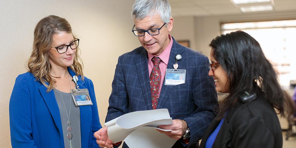 Program faculty from the Female Pelvic Reconstructive Surgery Fellowship talks with trainees at Mayo Clinic.
