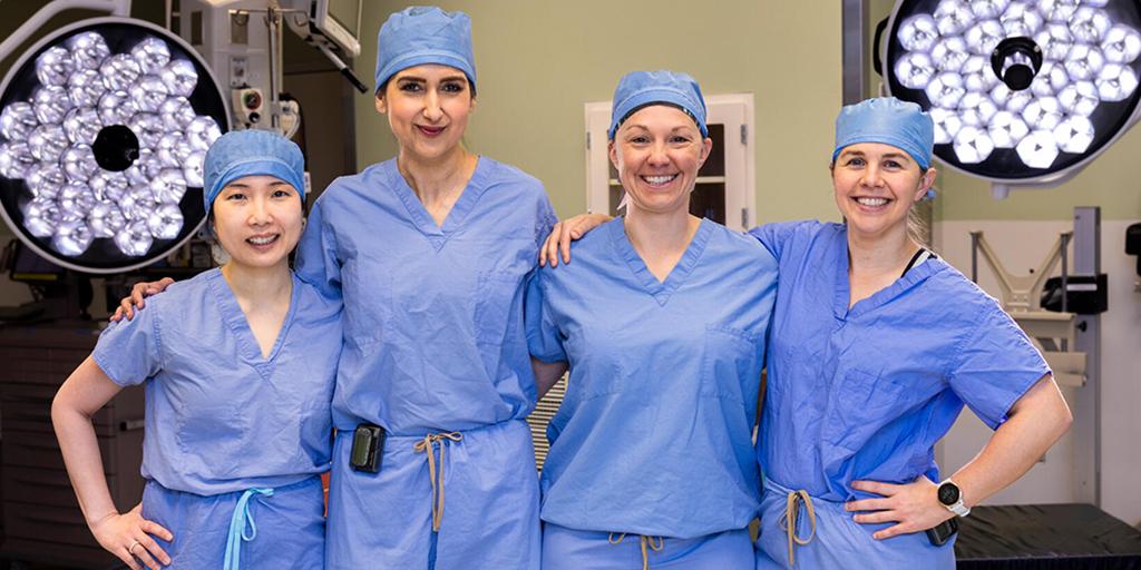 Group shot of general surgery residency program in Rochester, Minnesota, residents in an operating room.