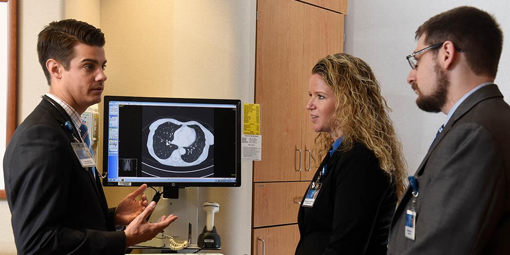 Mayo Clinic Hospice and palliative medicine fellows discussing a case